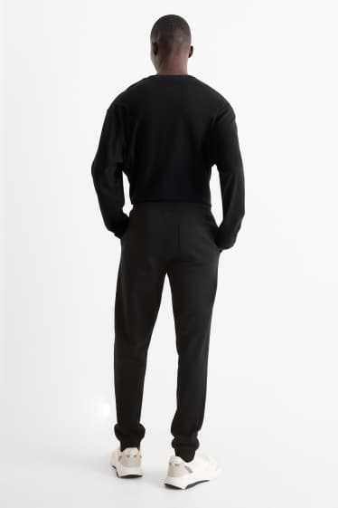 Hommes - Pantalon de jogging - noir
