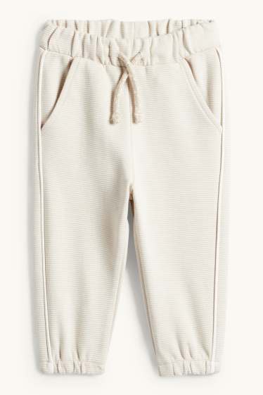 Nadó nen - Dinosaure - conjunt per a nadó - acanalat - 2 peces - beix