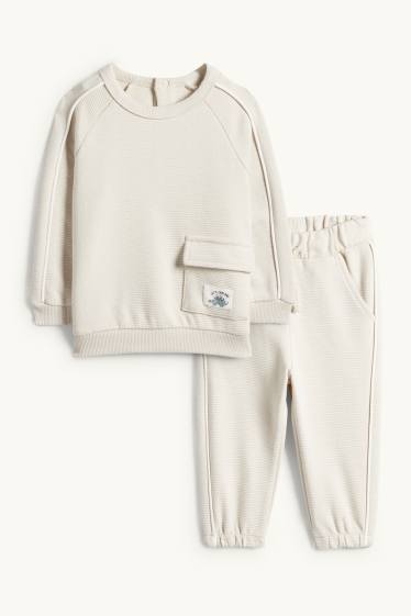 Nadó nen - Dinosaure - conjunt per a nadó - acanalat - 2 peces - beix