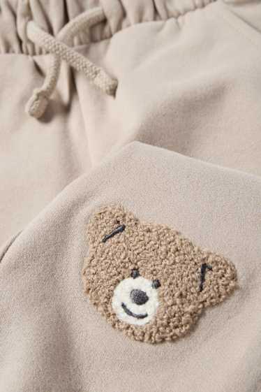 Miminka - chlapci - Medvídci - teplákové kalhoty pro miminka - světle šedá