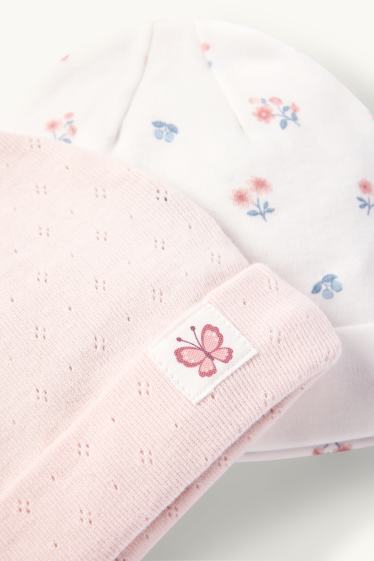 Bébés filles - Lot de 2 - petits fleurs et papillon - bonnet bébé - blanc / rose