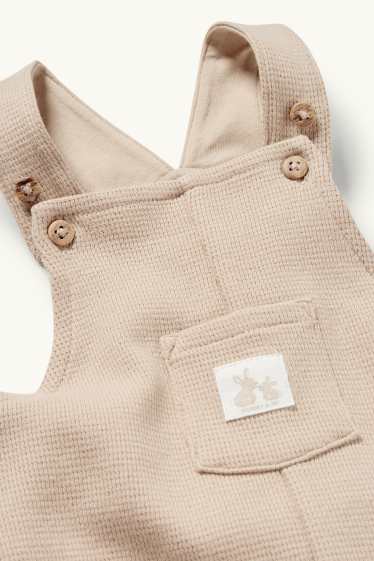 Unisex - Zajíčci - kalhoty s laclem pro miminka - strukturované - béžová