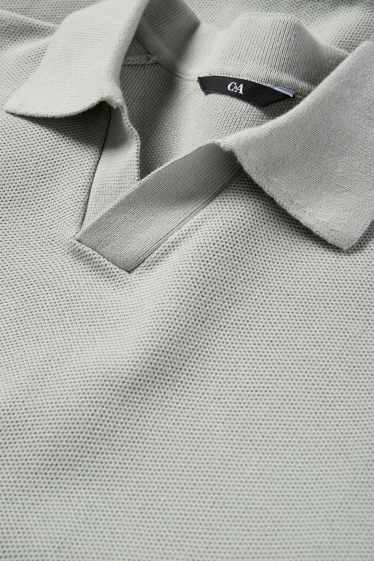 Hommes - Polo en maille - regular fit - finition texturée - gris