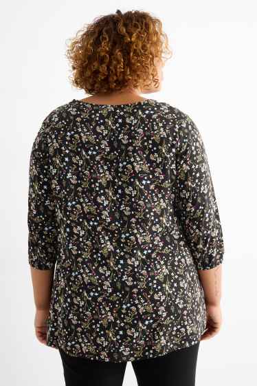 Dona - Brusa - de flors - negre