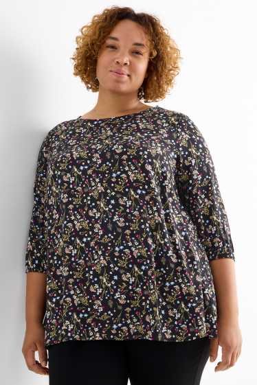 Dona - Brusa - de flors - negre