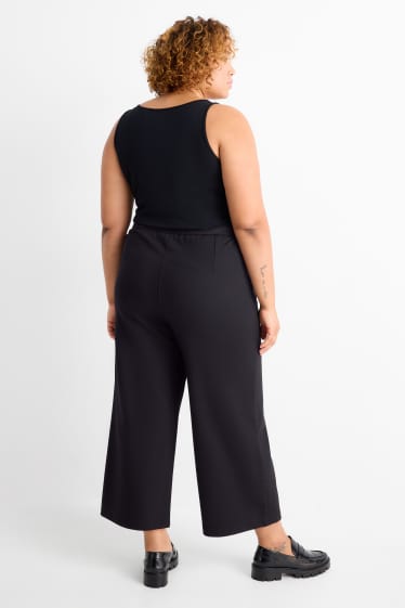 Dámské - Žerzejové kalhoty s páskem - high waist - wide leg - černá