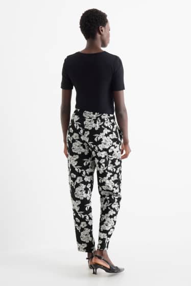 Women - Cloth trousers - high waist - tapered fit - floral - black / white
