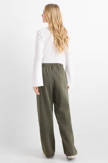 Dámské - Žerzejové kalhoty - mid waist - wide leg - s úzkými proužky - zelená