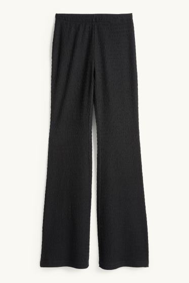 Dámské - Flared legíny - strukturované - černá