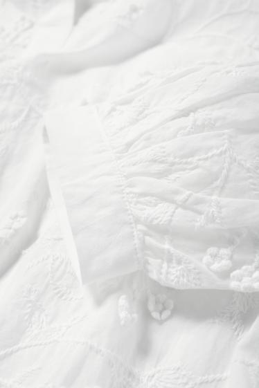 Dona - Brusa amb coll en punta - de flors - texturada - blanc