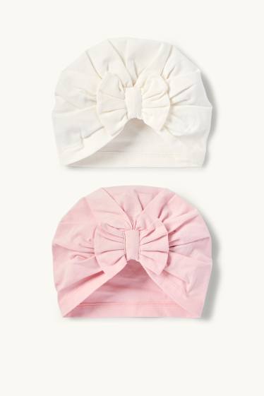Bebeluși - fete - Multipack 2 buc. - căciulă tip turban - alb / roz