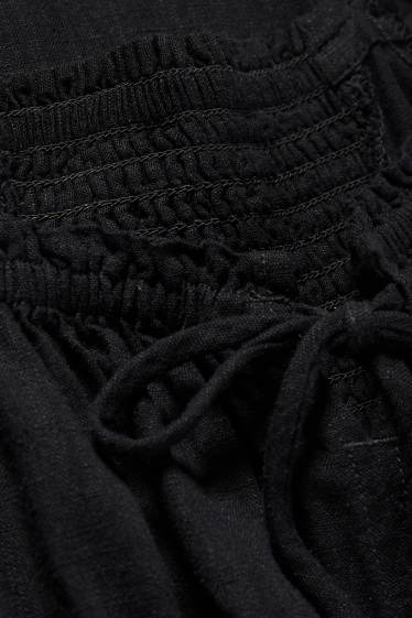Femmes - Robe avec fente et teneur en lin - finition smockée - noir
