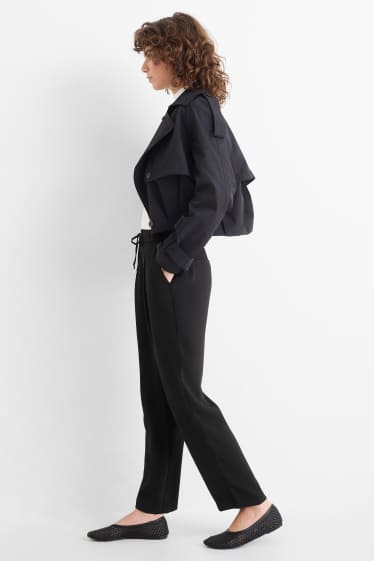 Dona - Pantalons de tela - mid waist - tapered fit - negre