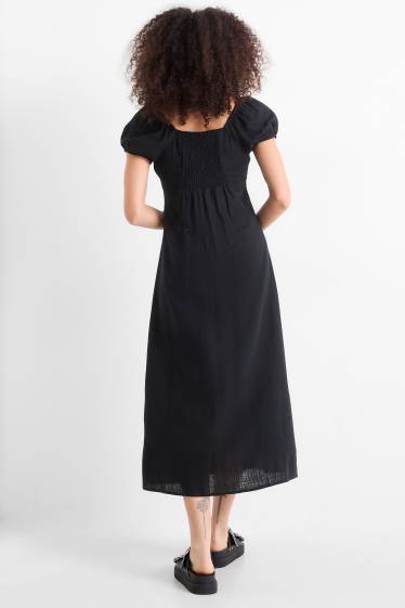 Femmes - Robe avec fente et teneur en lin - finition smockée - noir