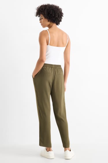 Dona - Pantalons de tela - mid waist - tapered fit - verd fosc
