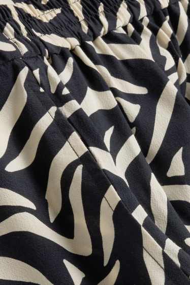 Dona - Pantalons de tela - mid waist - straight fit - estampats - blanc/negre