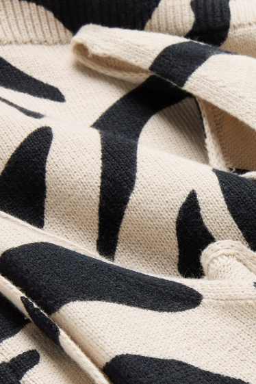 Femei - Top tricotat cu decolteu în V - cu model - negru / nej