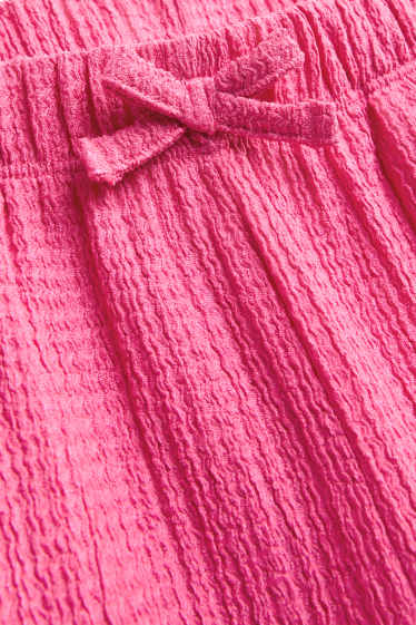 Enfants filles - Pantalon en toile - finition texturée - rose