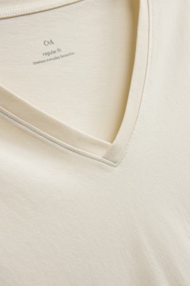 Dames - T-shirt met V-hals - regular fit - crèmekleurig