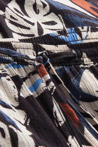 Femmes - Pantalon en toile - mid waist - wide leg - à motif - noir