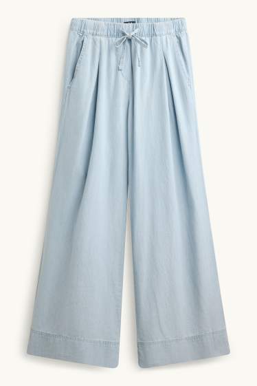 Dona - Pantalons de tela - mid waist - palazzo - blau clar