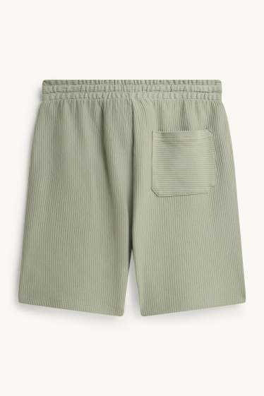 Uomo - Shorts - tessuto tramato - verde