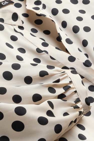 Damen - Bluse mit V-Ausschnitt - gepunktet - weiß / schwarz