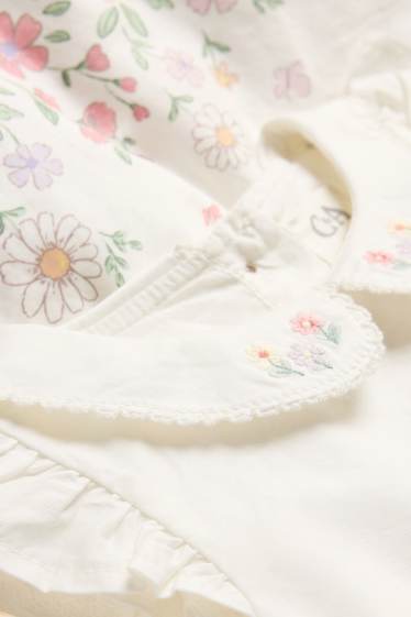Baby: meisjes - Bloemetje - babyjurk - wit