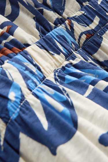 Damen - Jumpsuit mit V-Ausschnitt und Perlen - gemustert - blau / weiss