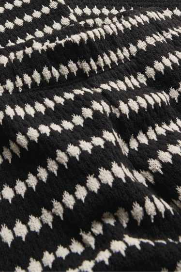 Femei - Pantaloni tricotați - talie înaltă - regular fit - cu model - negru / alb