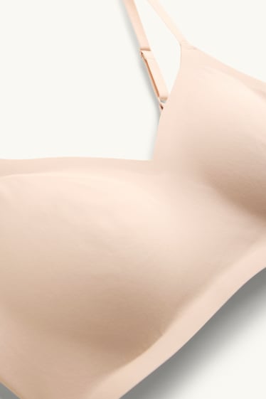 Dona - Sostenidors invisibles sense cèrcols - enconxats - beix