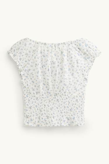 Femei - Bluză crop fără mâneci - cu flori - cu fronseuri - alb