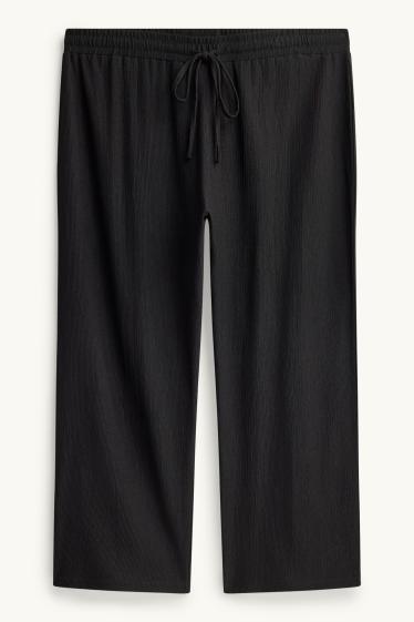 Femmes - Pantalon en jersey - mid waist - wide leg - finition texturée - noir