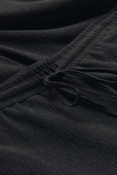 Femmes - Pantalon en jersey - mid waist - wide leg - finition texturée - noir