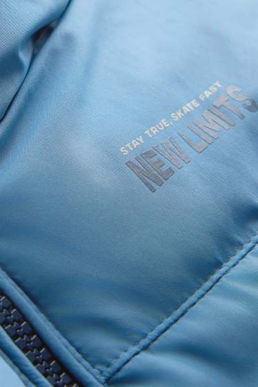 Kinderen: jongens - Bodywarmer met capuchon - waterafstotend - lichtblauw