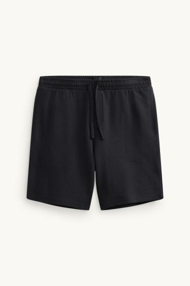 Uomo - Shorts di felpa - tessuto tramato - nero