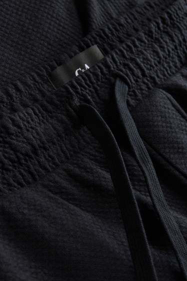 Uomo - Shorts di felpa - tessuto tramato - nero