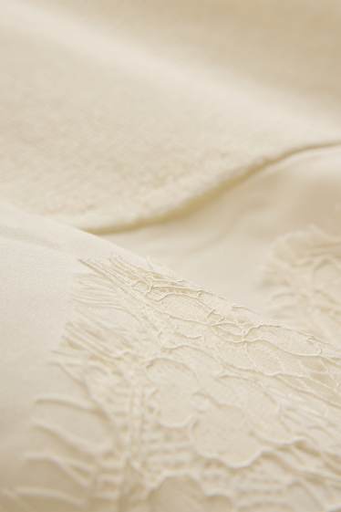 Dona - Jersei de punt - mànigues curtes - acanalat - crema