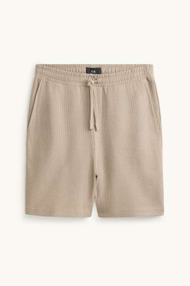 Hommes - Short en molleton - finition texturée - beige