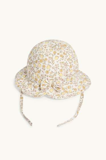 Baby: meisjes - Bloemetje en citroen - babyhoed - crèmekleurig