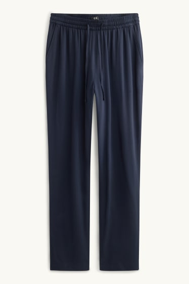 Dona - Pantalons de tela - mid waist - tapered fit - blau fosc