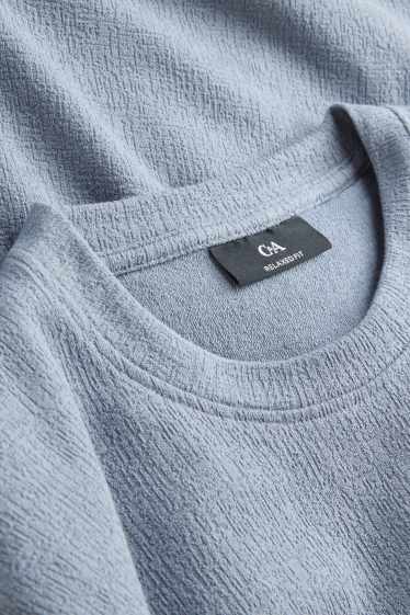 Mężczyźni - T-shirt - relaxed fit - niebieski