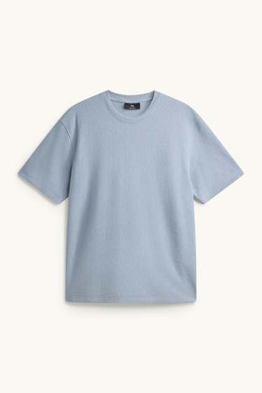 Mężczyźni - T-shirt - relaxed fit - niebieski