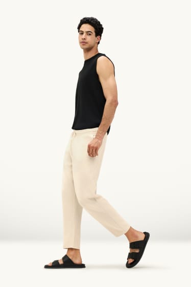 Mężczyźni - Spodnie dresowe - kremowy