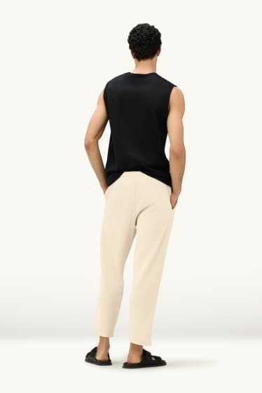 Mężczyźni - Spodnie dresowe - kremowy