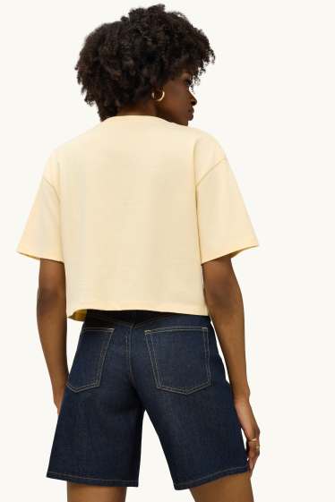 Dames - T-shirt - relaxed fit - lichtgeel