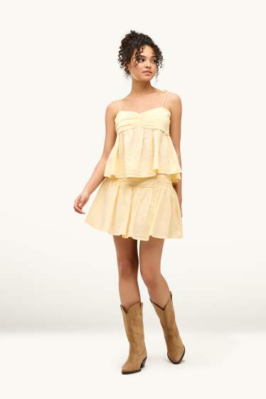 Femmes - Minijupe - finition texturée - jaune clair