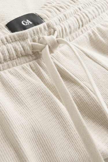 Uomo - Shorts in felpa - tessuto tramato - bianco crema