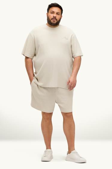 Uomo - Shorts in felpa - tessuto tramato - bianco crema