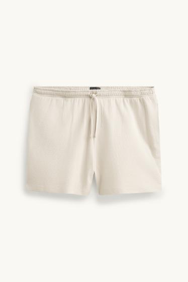 Uomo - Shorts in felpa - tessuto tramato - bianco crema